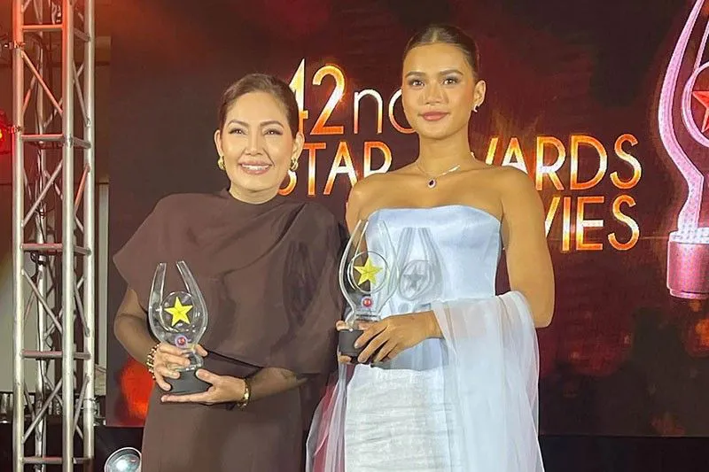 Film award trophies arranged on a stage