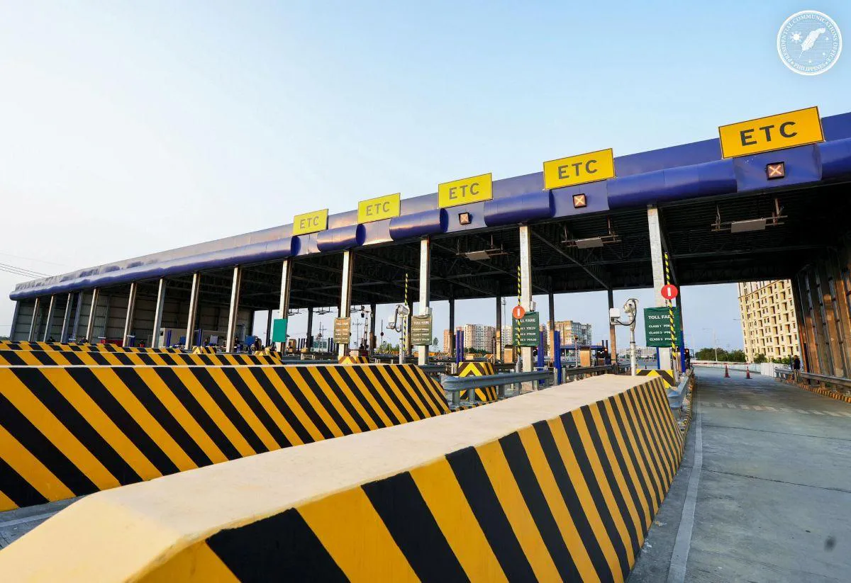 Vehicles approaching toll booths on an expressway