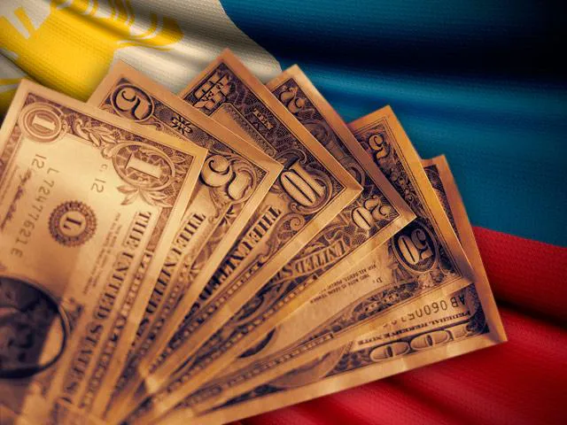 Philippine peso banknotes beside US dollar notes