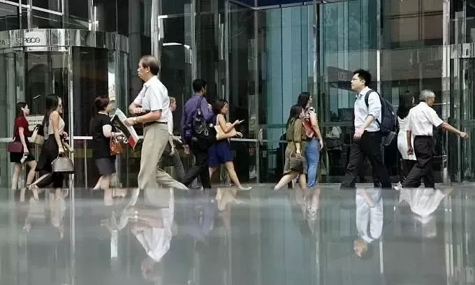 Office workers walking through Singapore's central business district