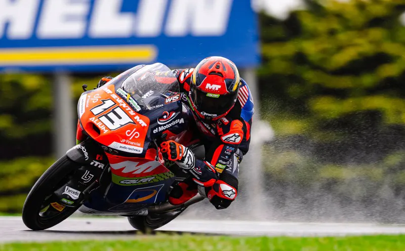 Motorcycle racing circuit with kerbs and grandstands