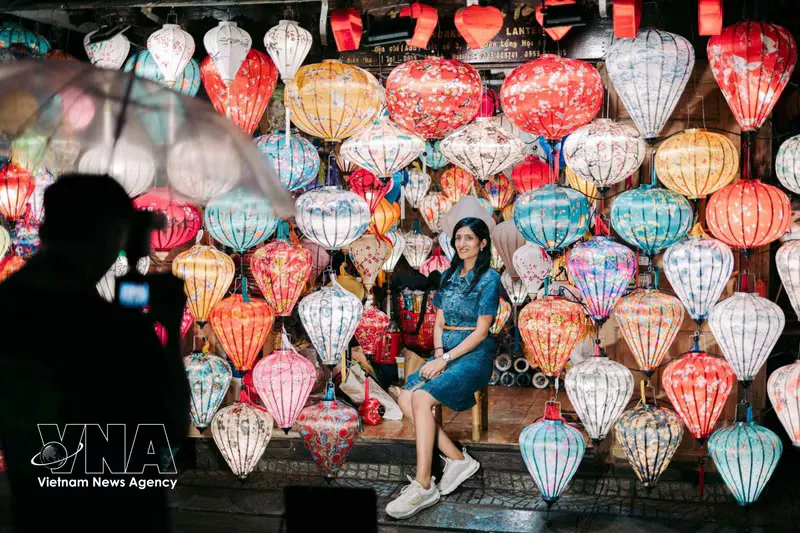 Colourful lanterns hanging above a street in Hoi An