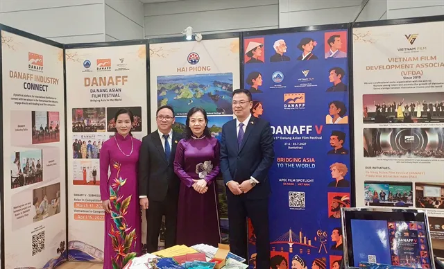 Film market exhibition booths with screens and promotional posters