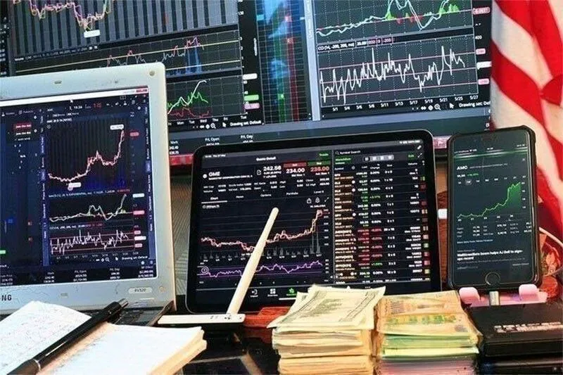 Stock market figures displayed beside Philippine peso banknotes