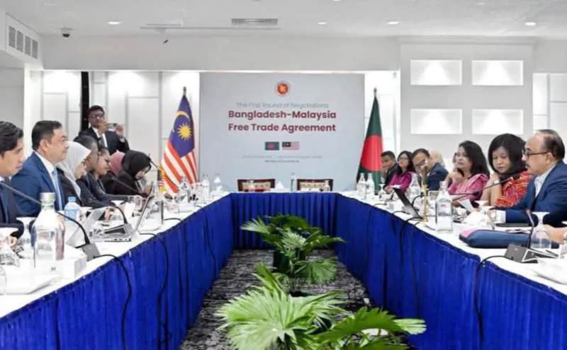 Documents and microphones arranged on a conference table