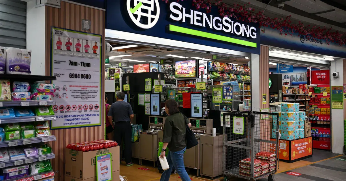 Supermarket aisles lined with groceries and household products