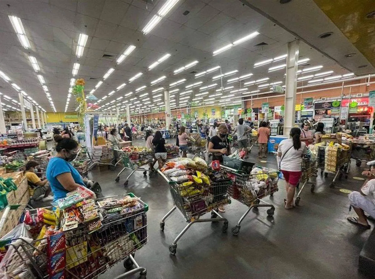 Rice, vegetables and other food staples displayed at a market