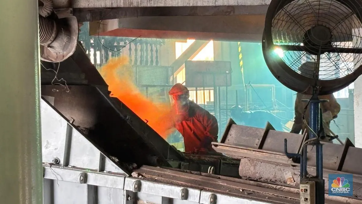 Tin ingots stacked in an industrial warehouse