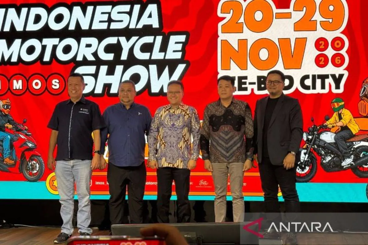 Motorcycles and riding accessories displayed in an exhibition hall