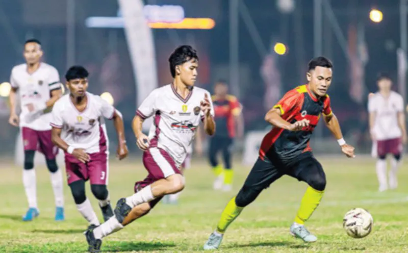 Football on a grass pitch beside a white touchline