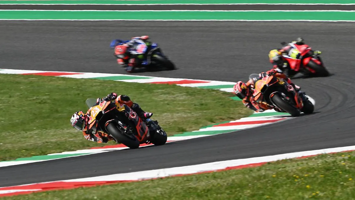 Motorcycle racing circuit with pit garages and trackside barriers