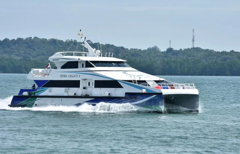 Illustration of an electric passenger ferry beside a charging point at a jetty