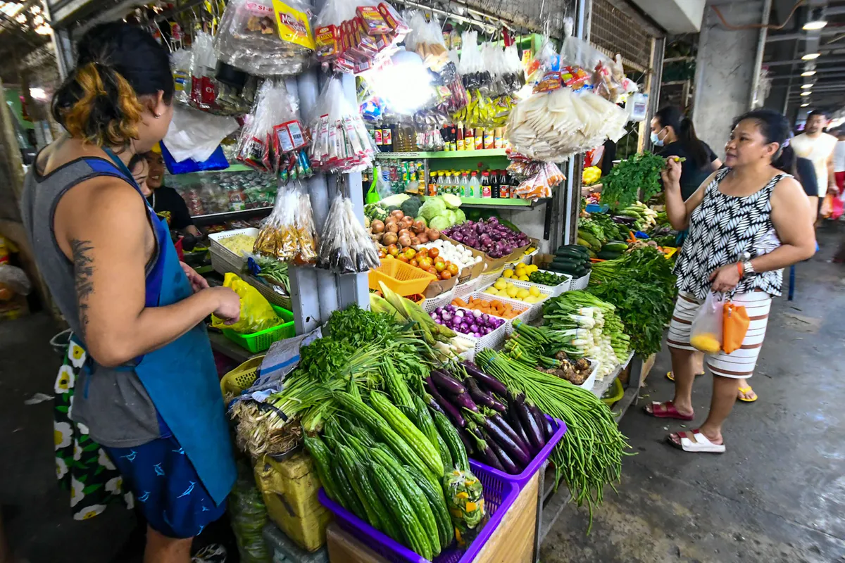 Food stalls and produce at a market in the Philippines