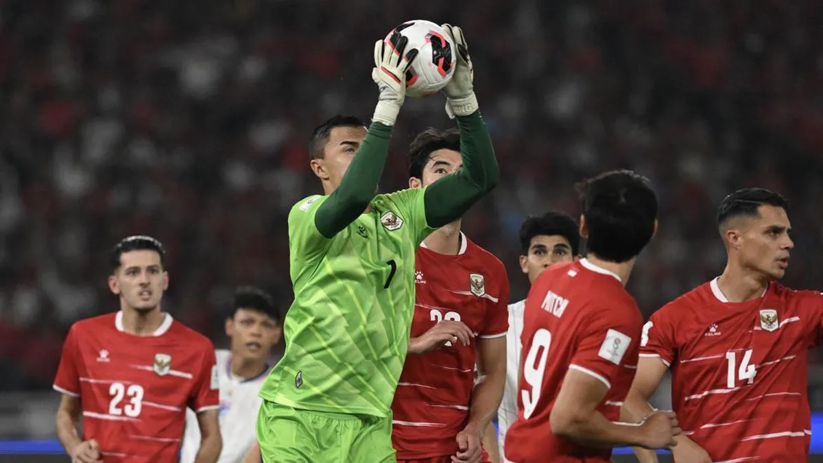 Football on the penalty spot in front of a goal